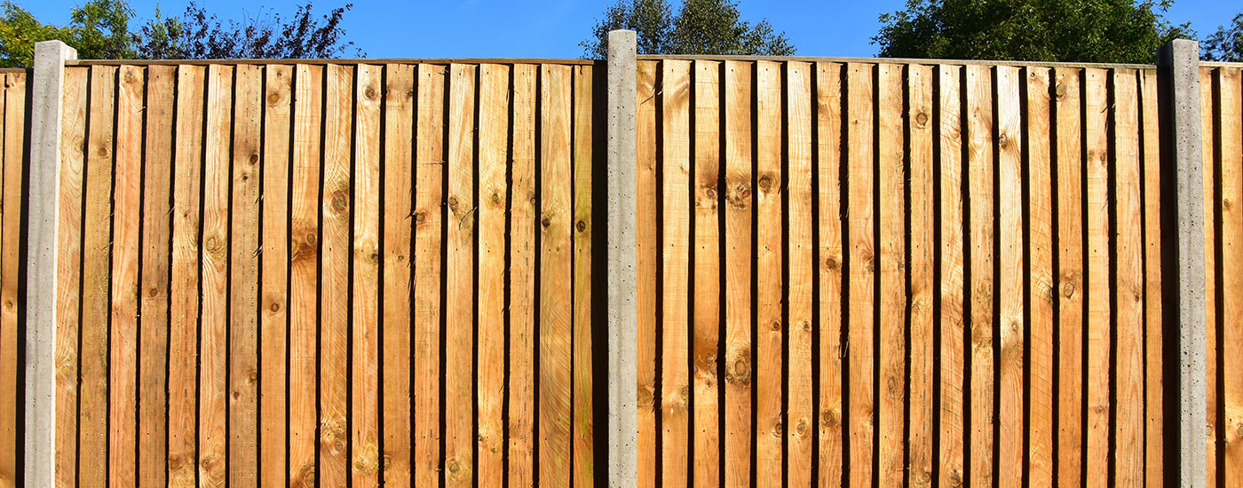 How-to-build-a-fence-with-concrete-posts-and-gravel-boards-1400x550.jpg