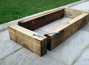 How-to-build-raised-beds-with-sleepers-300x220.jpg